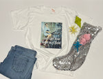 Load image into Gallery viewer, “White ‘Don’t Get Your Tinsel In A Twist’ western holiday graphic tee flat lay”

